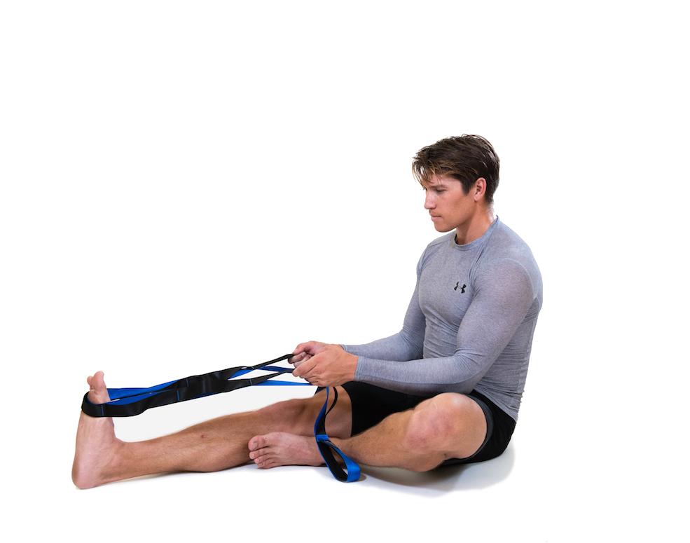 man using mobility stretching strap