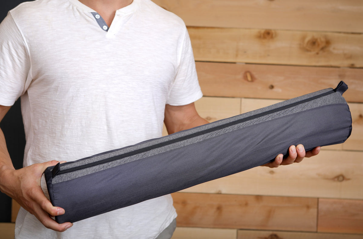 man holding Morph Extension Kit for travel foam roller